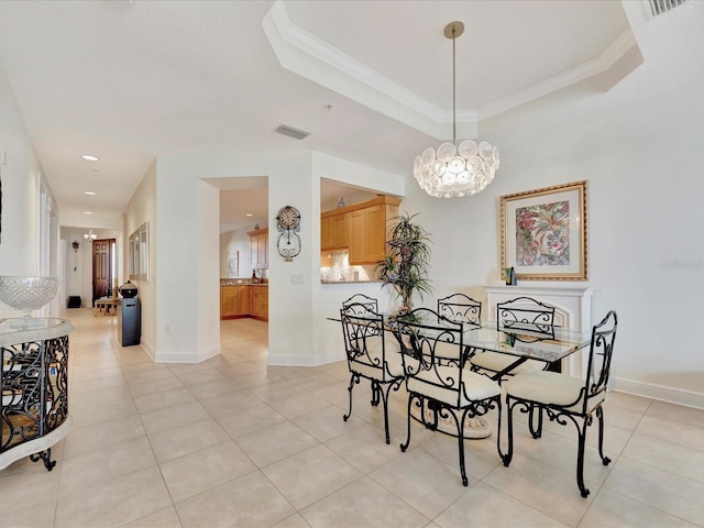 tiled dining room featuring a raised ceiling, a notable chandelier, and crown molding