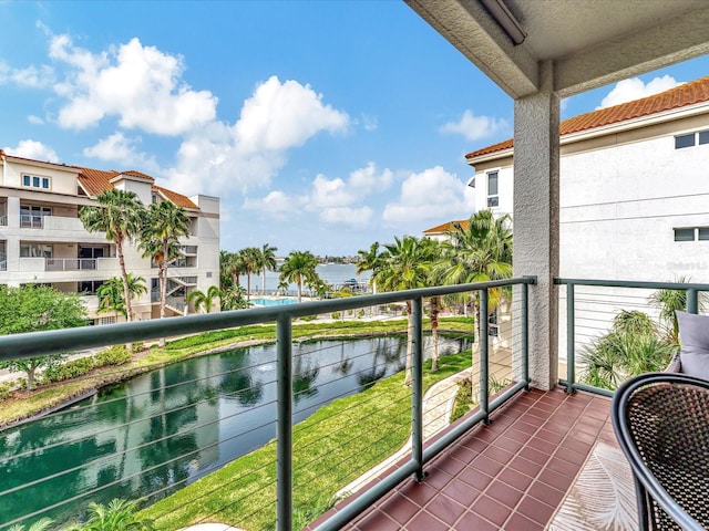 balcony featuring a water view