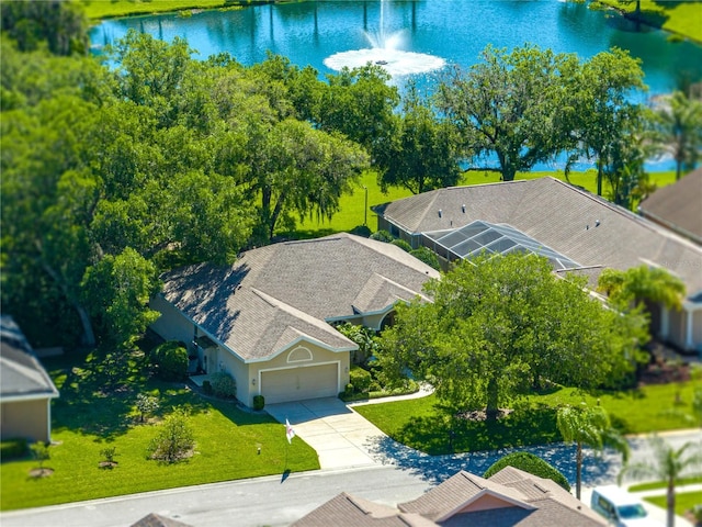 birds eye view of property with a water view