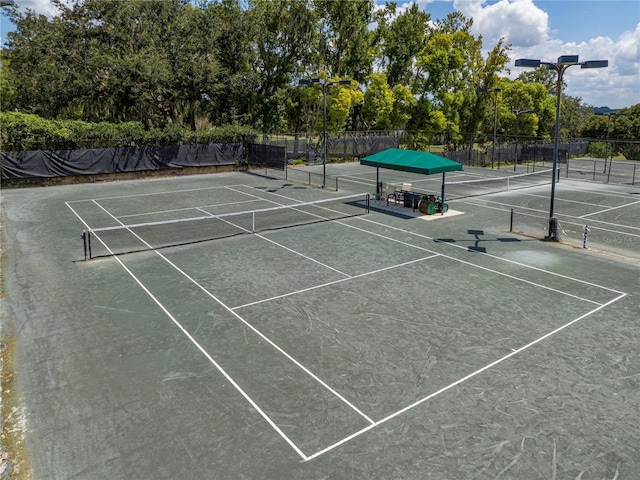 view of tennis court with fence