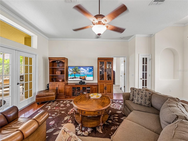 living room featuring ceiling fan, crown molding, and french doors