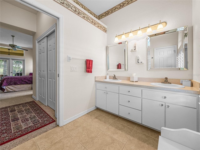 bathroom featuring dual bowl vanity, tile patterned flooring, and ceiling fan