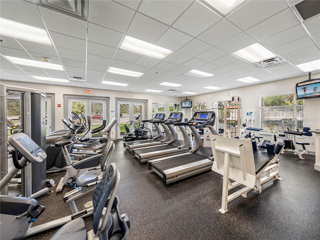 workout area with french doors and a drop ceiling