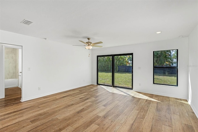 spare room featuring ceiling fan and light wood-type flooring