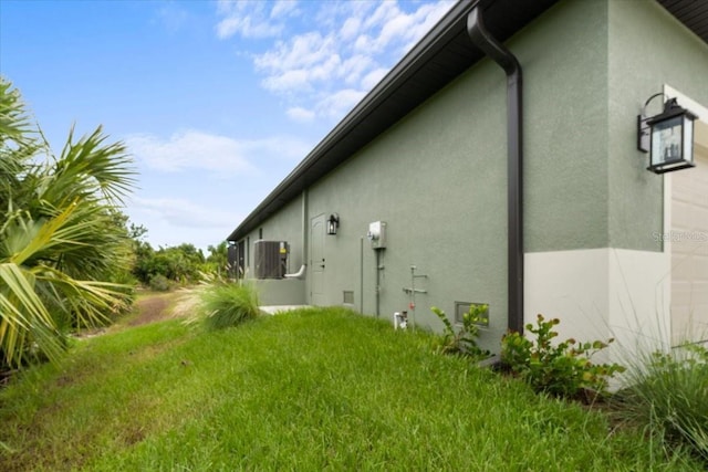 view of property exterior with a lawn