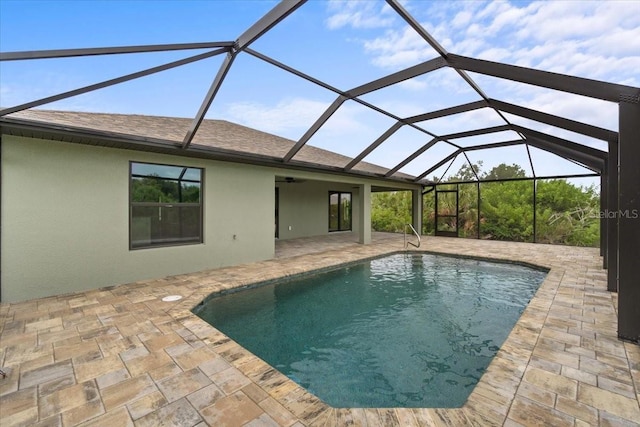 view of swimming pool with a lanai and a patio