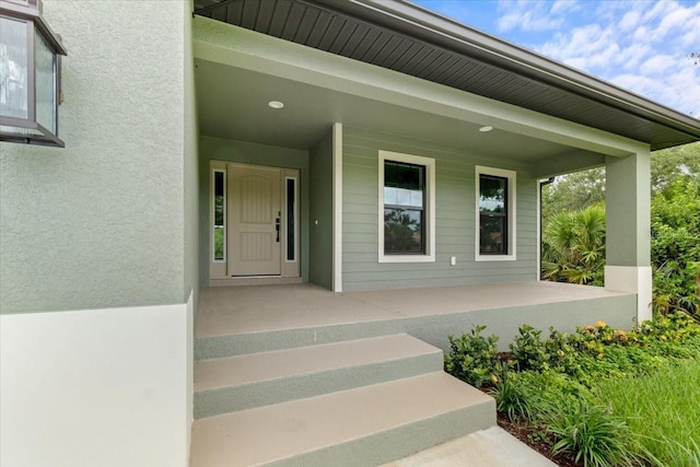 doorway to property featuring a porch