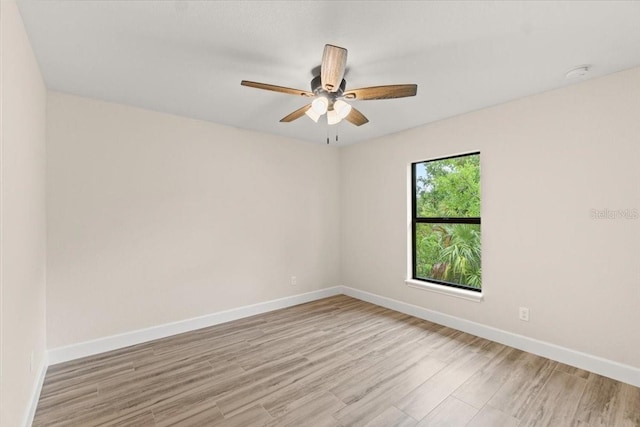 unfurnished room featuring ceiling fan and light hardwood / wood-style flooring