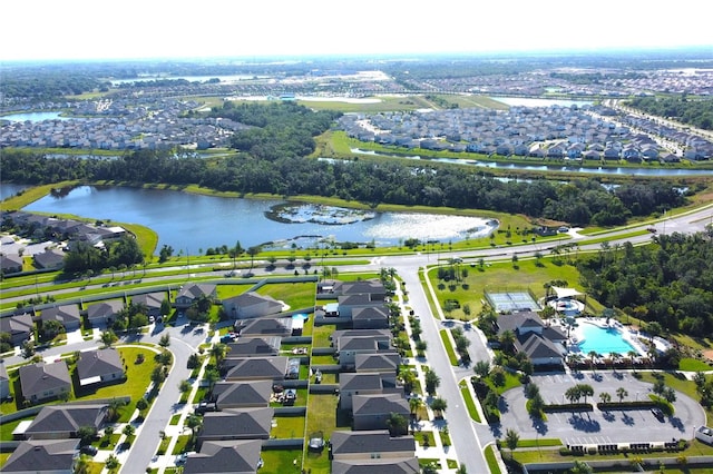 drone / aerial view featuring a residential view and a water view