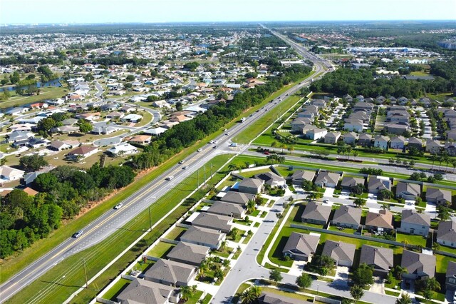 birds eye view of property with a residential view