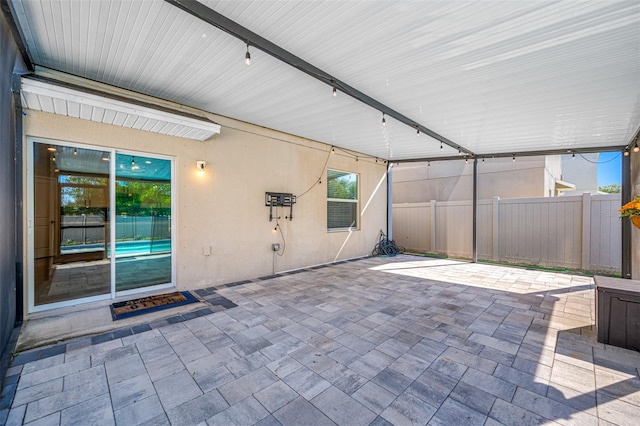 view of patio / terrace featuring fence