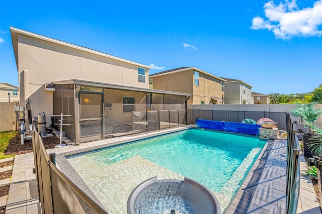 view of pool with a sunroom