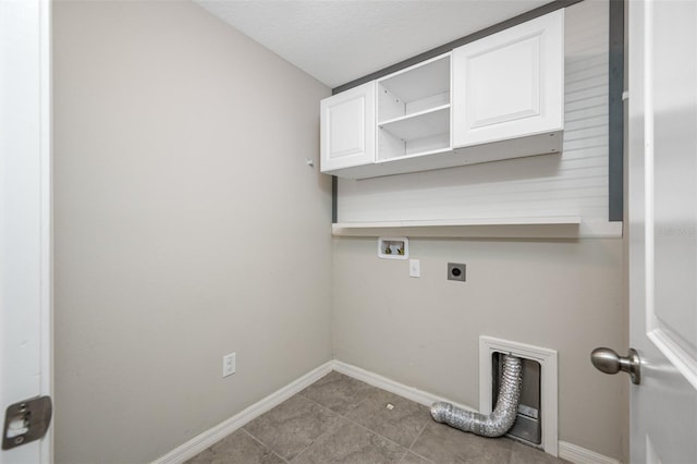 laundry area with hookup for a washing machine, cabinet space, hookup for an electric dryer, and baseboards