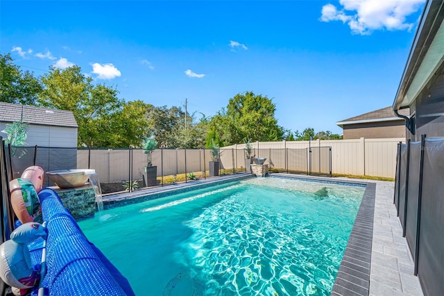 view of swimming pool featuring a fenced backyard and a fenced in pool