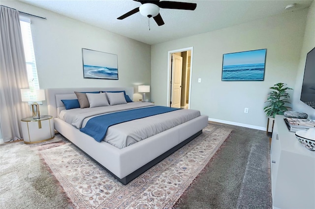 carpeted bedroom with baseboards and a ceiling fan