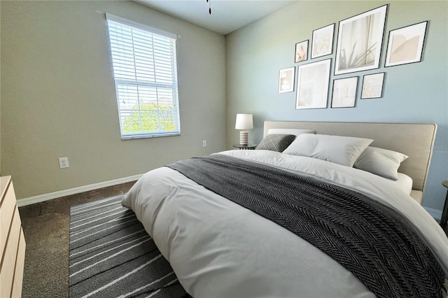 bedroom with carpet flooring and baseboards