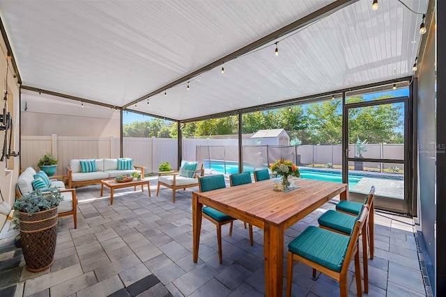 sunroom / solarium with track lighting