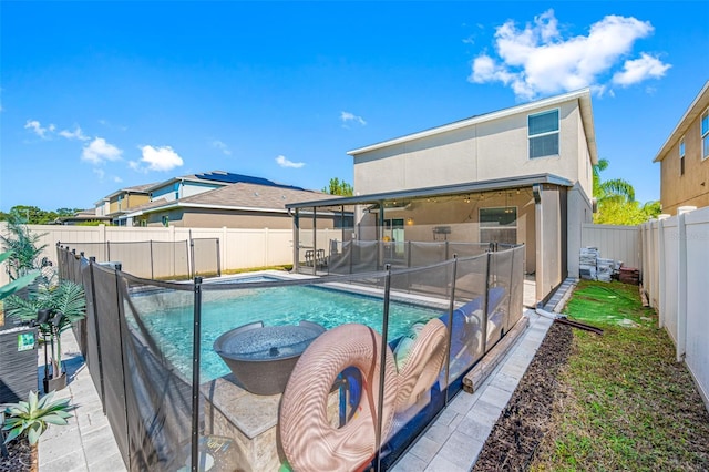 view of pool featuring a patio, a fenced backyard, and a fenced in pool