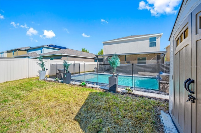 view of swimming pool featuring a fenced backyard, a fenced in pool, and a yard