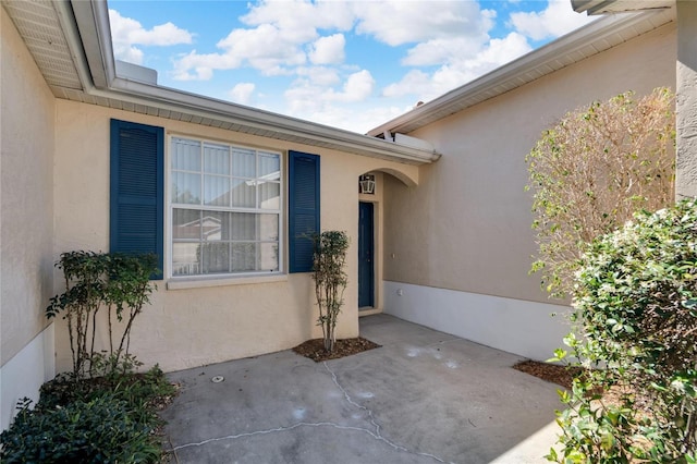 entrance to property with a patio area