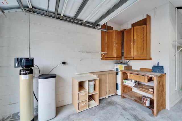 interior space featuring water heater and a workshop area