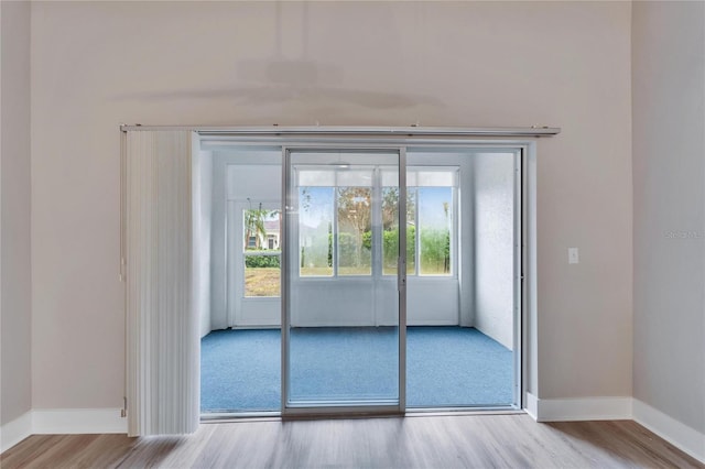 doorway to outside with light hardwood / wood-style floors