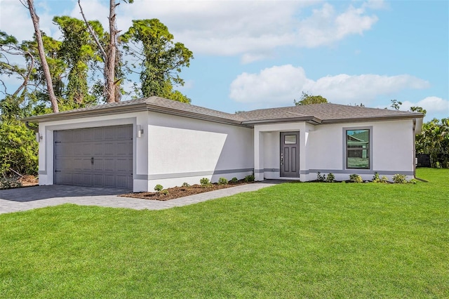 view of front facade with a front yard and a garage