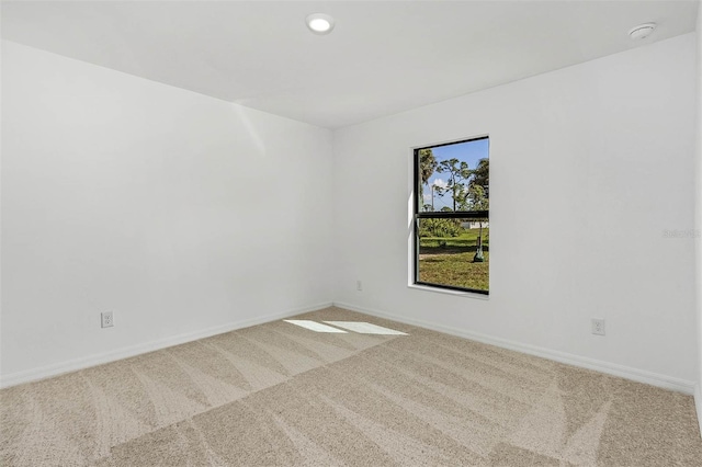 empty room featuring light colored carpet