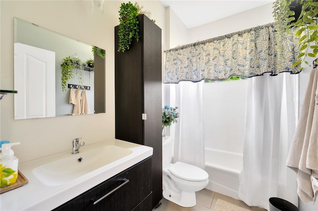 full bathroom featuring shower / bath combination with curtain, toilet, vanity with extensive cabinet space, and tile flooring