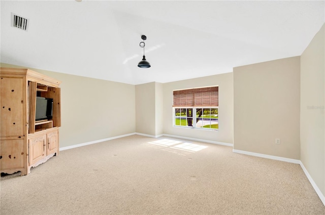 unfurnished room with light colored carpet