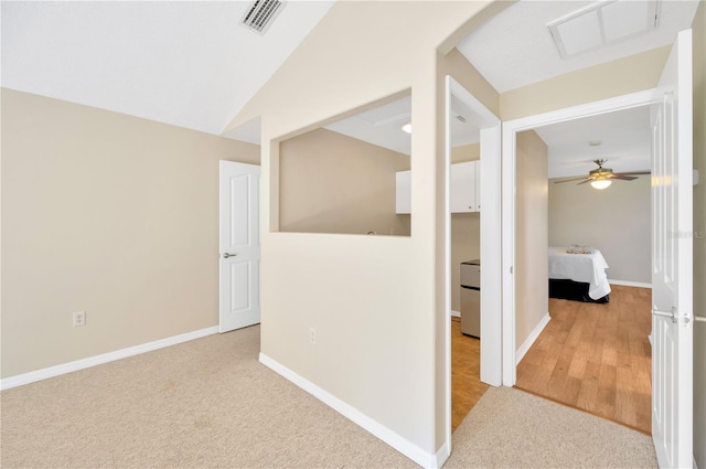 basement with ceiling fan and light wood-type flooring