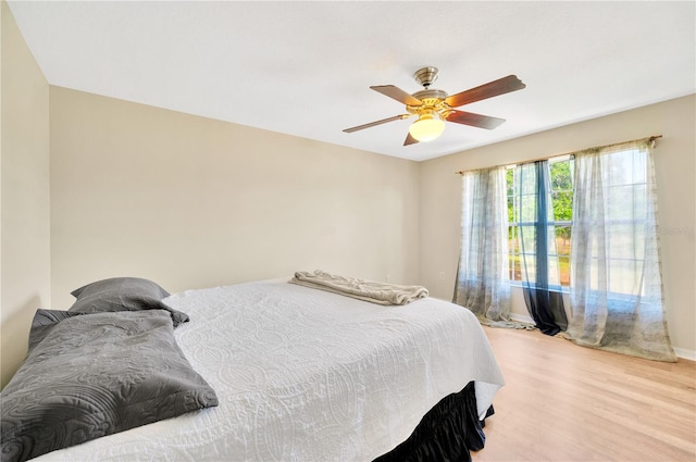 bedroom featuring ceiling fan and light hardwood / wood-style flooring