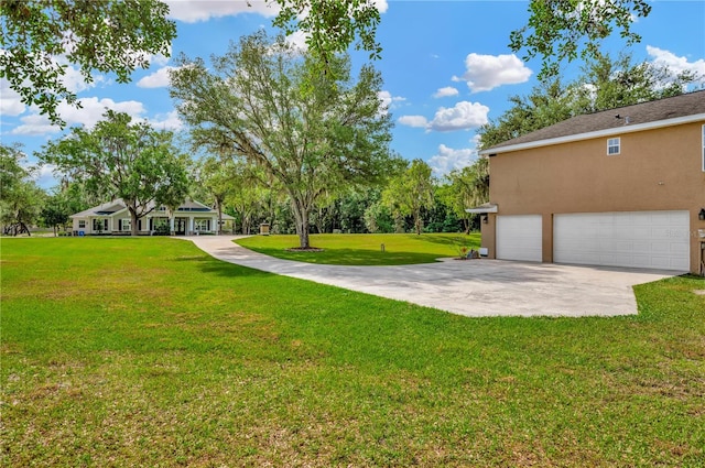 view of yard featuring a garage