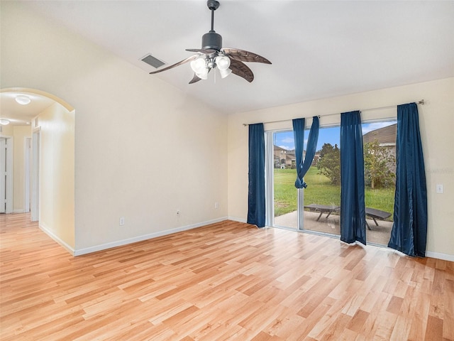 empty room with ceiling fan and light hardwood / wood-style floors