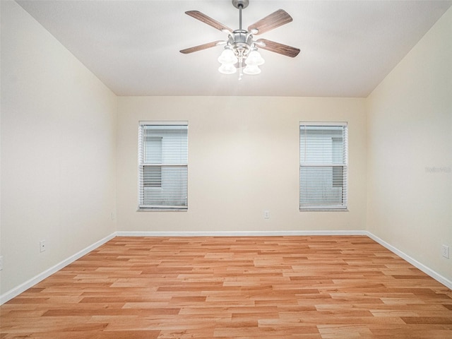 spare room featuring light wood-type flooring and ceiling fan