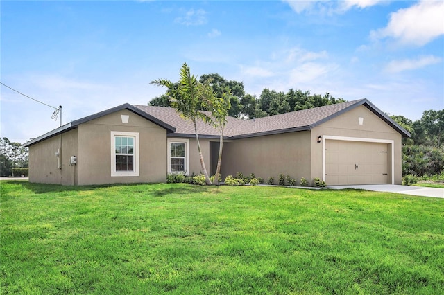 ranch-style house featuring a front yard and a garage