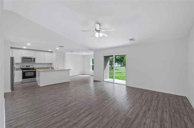 interior space featuring sink, ceiling fan, dark wood-type flooring, and lofted ceiling