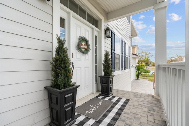 entrance to property featuring covered porch