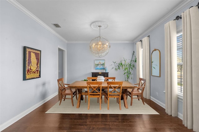 dining room with a chandelier, dark hardwood / wood-style floors, and ornamental molding