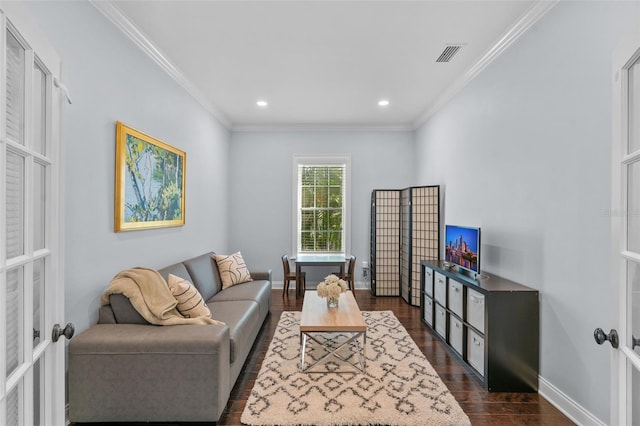 living room featuring dark hardwood / wood-style flooring, ornamental molding, and french doors