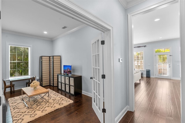 corridor featuring crown molding and dark hardwood / wood-style floors