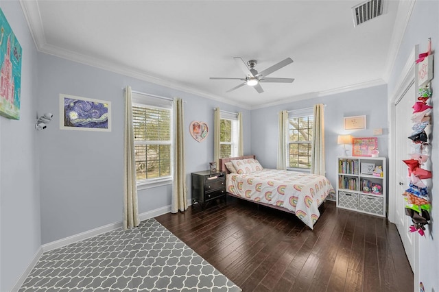 bedroom with dark hardwood / wood-style flooring, ceiling fan, and ornamental molding