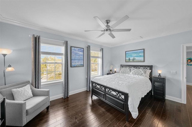 bedroom featuring ceiling fan, dark hardwood / wood-style flooring, and crown molding