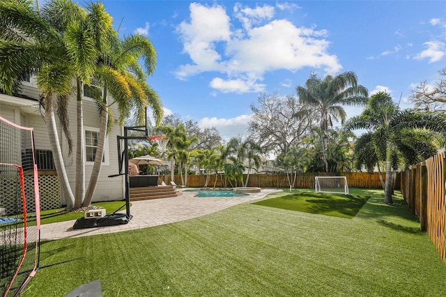 view of yard with a fenced in pool and a patio area