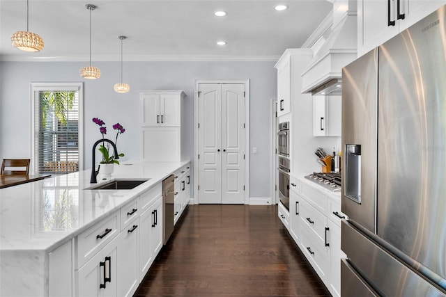 kitchen featuring pendant lighting, dark wood-type flooring, appliances with stainless steel finishes, light stone counters, and white cabinetry