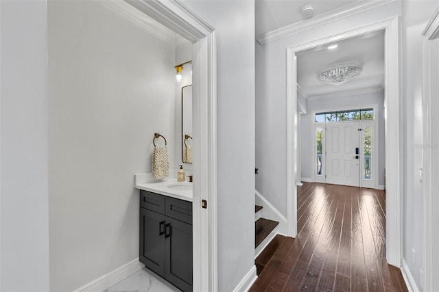 corridor featuring crown molding and hardwood / wood-style floors