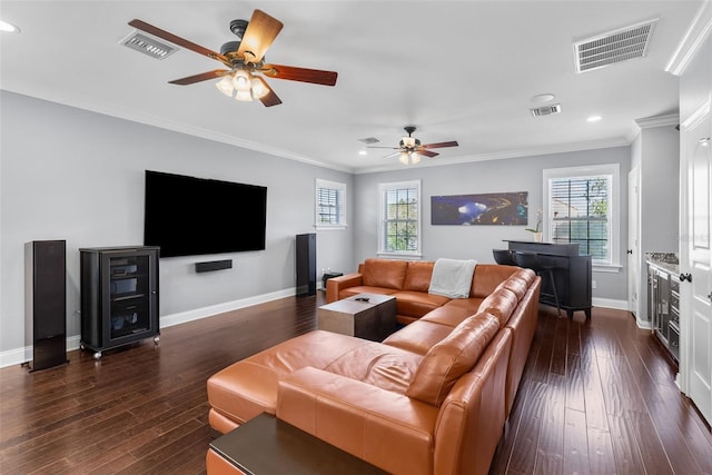 living room with ceiling fan, dark wood-type flooring, and ornamental molding