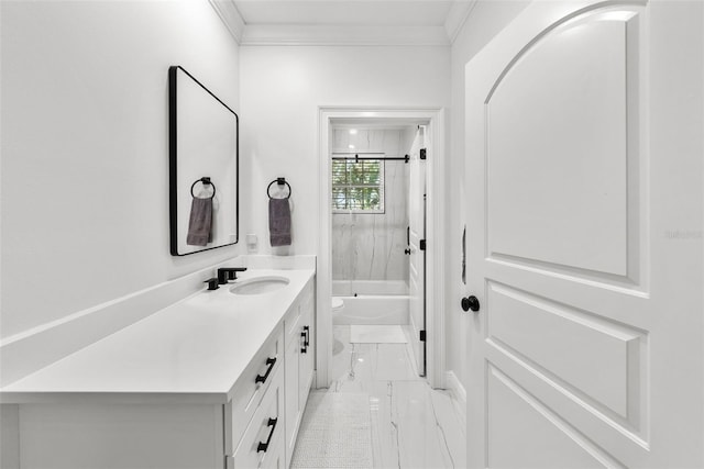 full bathroom featuring vanity, toilet, crown molding, and bathtub / shower combination