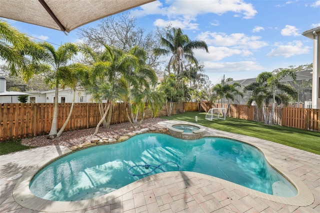 view of swimming pool with a lawn, an in ground hot tub, and a patio