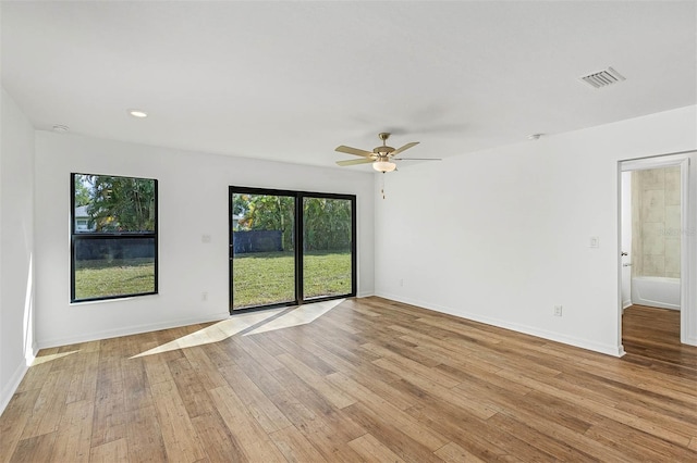 unfurnished room with ceiling fan and light hardwood / wood-style flooring